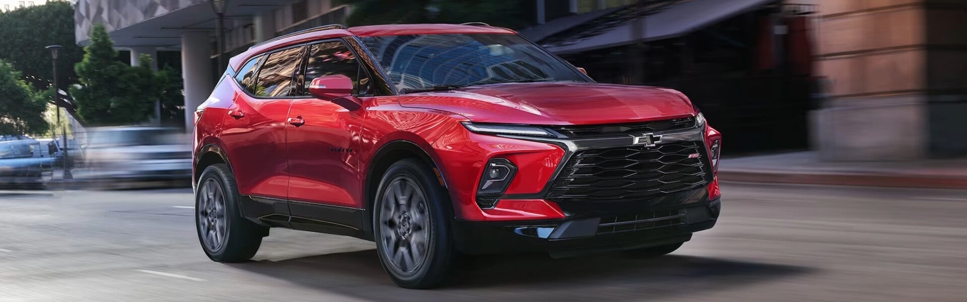 2024 Chevy Blazer in red driving on the road